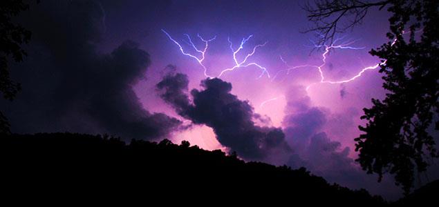 Lightning with a dark purple sky over the Allegheny Forest