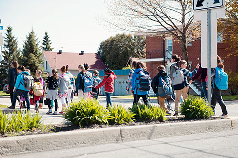 Students walking with backpacks